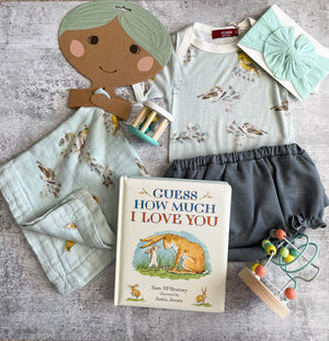 Flat lay of items from baby collection -Smockingbird’s Unique Gifts