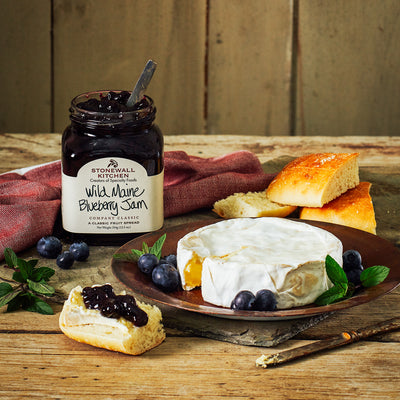 Stonewall Kitchen Wild Maine Blueberry Jam, stylized with brie and bread - Smockingbird's